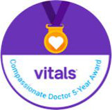 A round badge showing a gold medal with a heart, the word “vitals,” and the text “Compassionate Doctor 5-Year Award” on a purple and white background.
